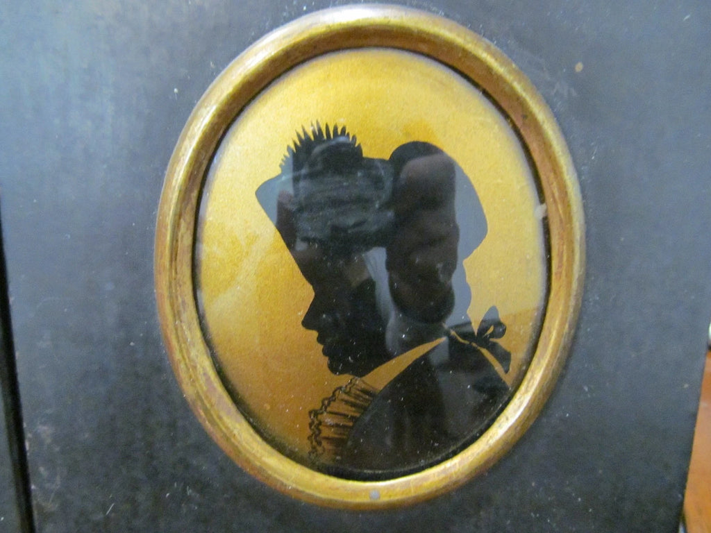 Antique Pair Of Regency Silhouettes painted with convex glass wood frames